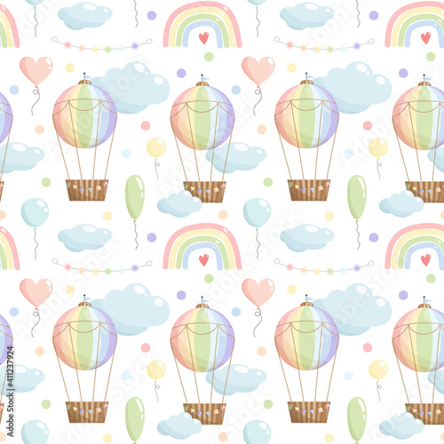 Rainbow color seamless pattern with hot air balloon, rainbow, balloons, clouds, garland on white background. © NinaBrai