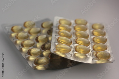 Closeup of a blister pack of omega 3 capsules.