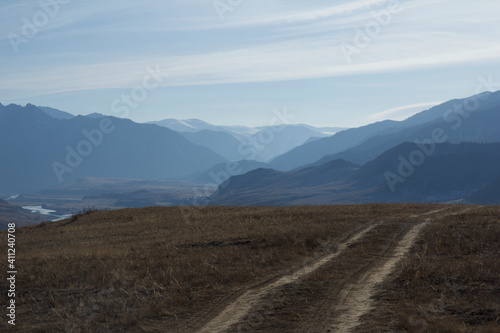 Landscape with the road in the mountains in smoky day