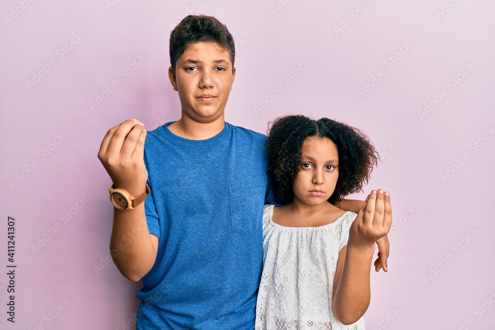 Young hispanic family of brother and sister wearing casual clothes together doing italian gesture with hand and fingers confident expression Young hispanic family of brother and sister wearing casual clothes together doing italian gesture with hand and fingers confident expression