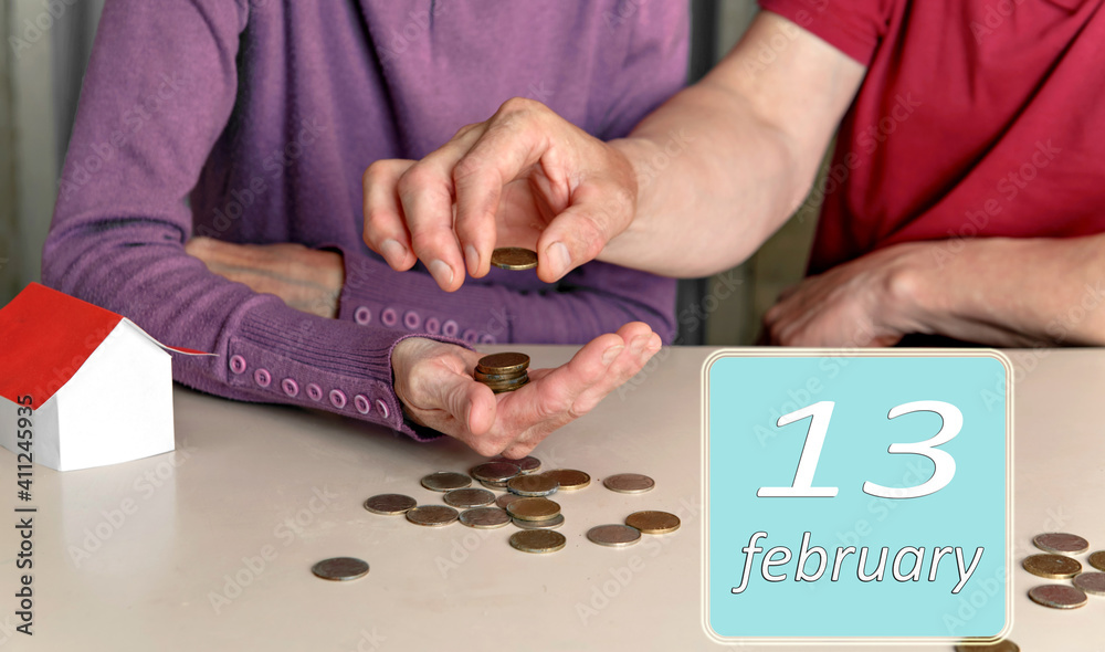 Obraz premium February 13, 13th day of month. Reminder to plan family budget together for woman and man. Winter month.Day of the year concept.