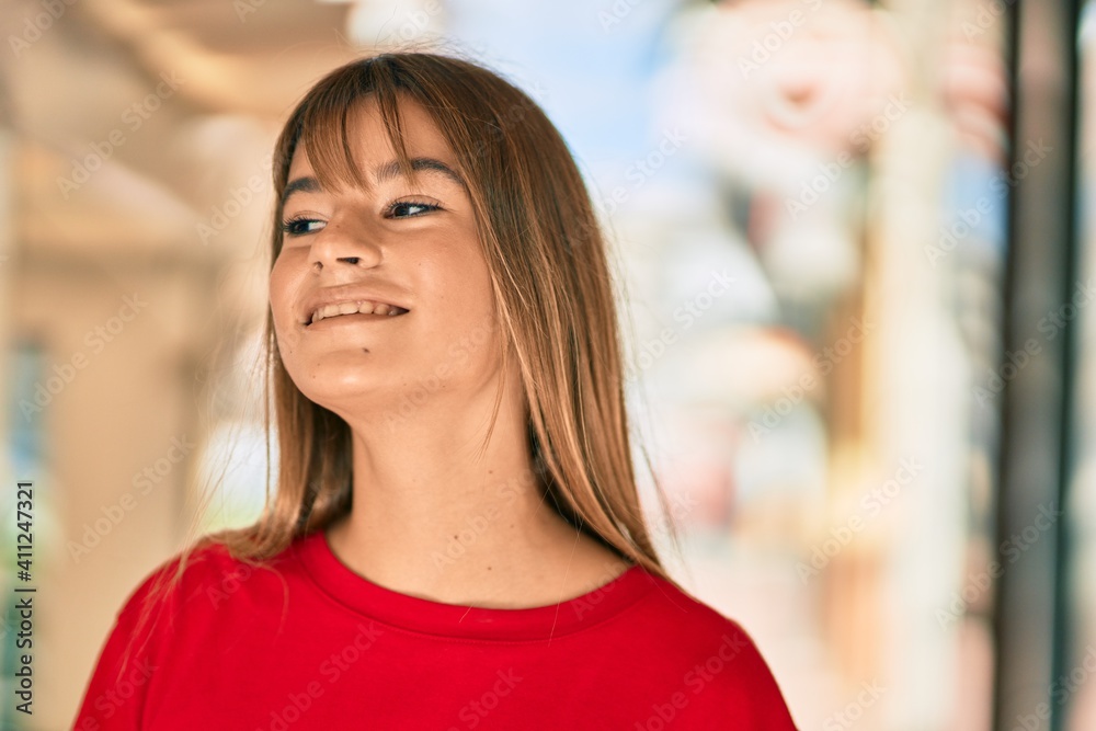 Caucasian teenager girl smiling happy standing at the city. Caucasian teenager girl smiling happy standing at the city.