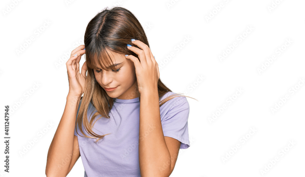 Teenager caucasian girl wearing casual clothes with hand on head for pain in head because stress. suffering migraine. Teenager caucasian girl wearing casual clothes with hand on head for pain in head because stress. suffering migraine.