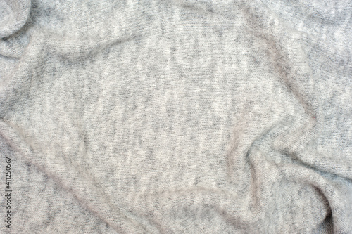 Knitted gray background. Textures for backgrounds. 