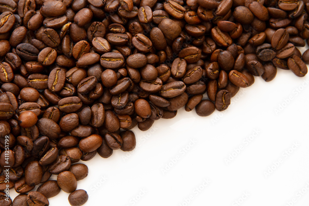 Coffee beans isolated on white background with copyspace for text. Coffee background or texture concept. Coffee beans isolated on white background with copyspace for text. Coffee background or texture concept.