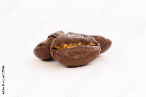 roasted coffee beans isolated on white background cutout