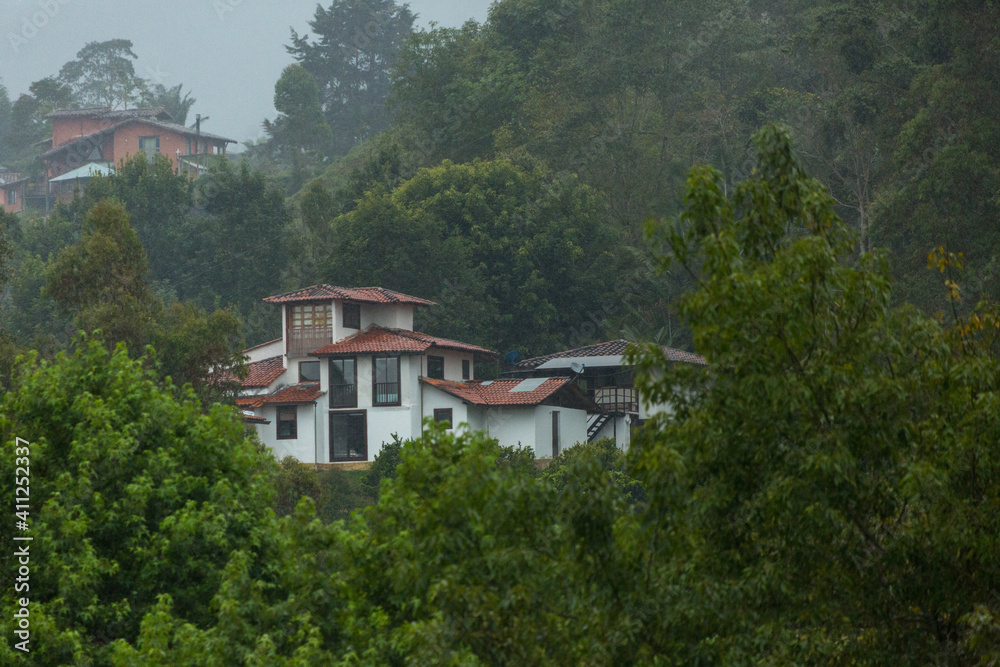 house in the mountains under rain