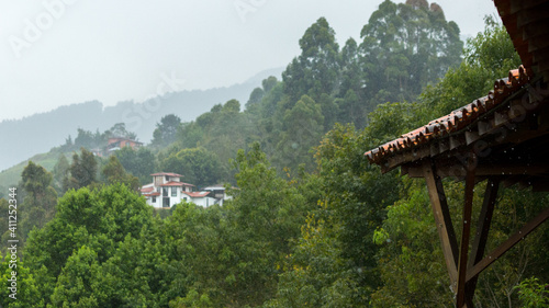 house in the mountains under rain