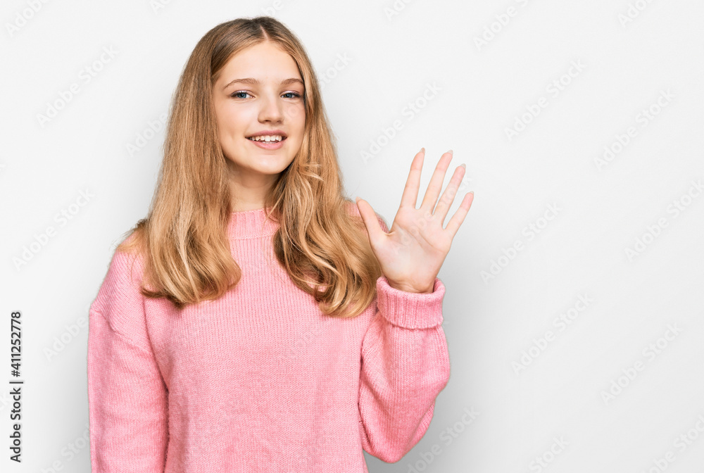 Beautiful young caucasian girl wearing casual winter sweater showing and pointing up with fingers number five while smiling confident and happy. Beautiful young caucasian girl wearing casual winter sweater showing and pointing up with fingers number five while smiling confident and happy.