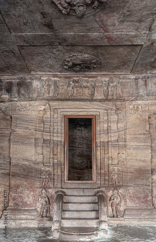 Badami, Karnataka, India - November 7, 2013: Cave temples above Agasthya Lake. Portrait of steps and door into empty sanctum at cave 3.