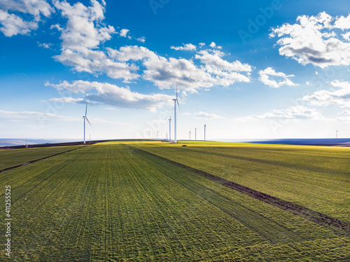Tablou pe pânză Beautiful bright Landscape with a Windfarm on a sunny day with a sky full of clo