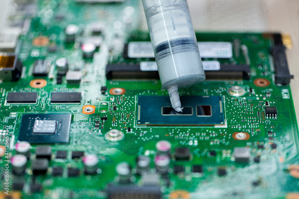 Thermal paste is applied to the laptop processor.