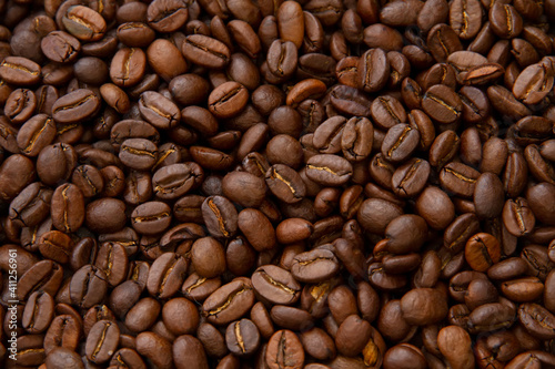 Roasted coffee beans heap isolated on white background can be used as background