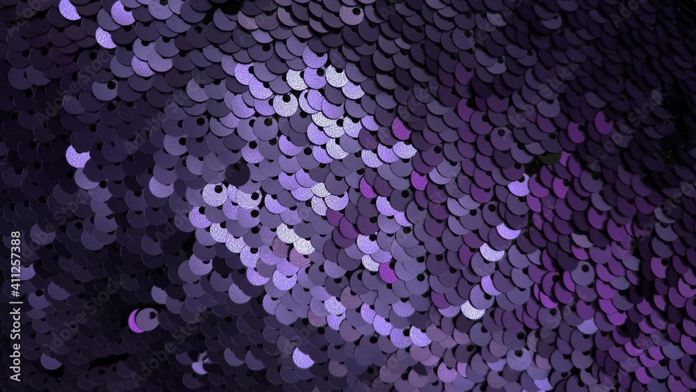 Obraz premium Dark violet and purple sequined background, shimmering fabric