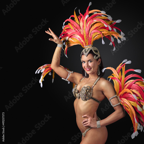 Obraz na plátně Beautiful showgirl in carnival suit with rhinestones and feathers