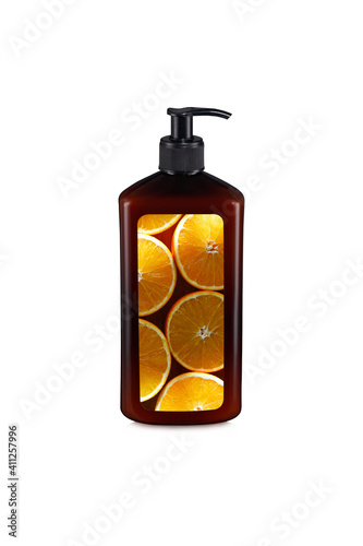 Brown glossy plastic bottle with pump dropper and with the image of a orange isolated on white background.