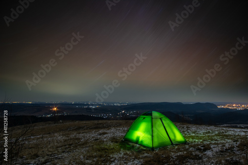 Tent on the trails of the stars in winter on the mountain © onyx124