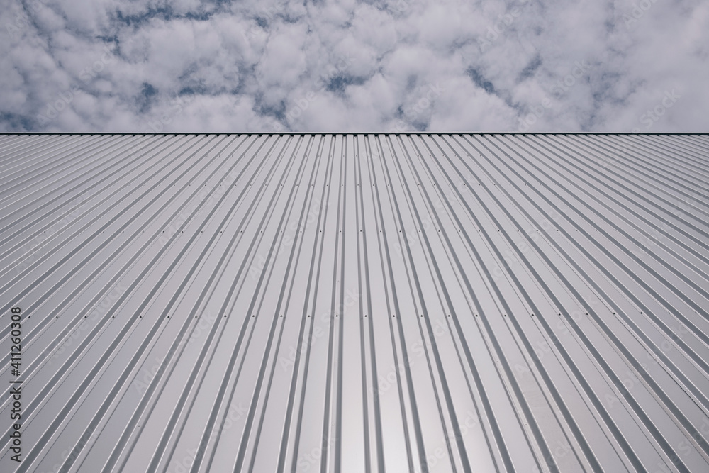 Corrugated iron sheet, aluminum Facade of a warehouse as background texture