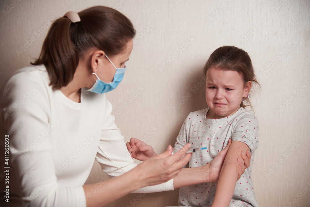 a frightened child is afraid of an injection a frightened child is afraid of an injection