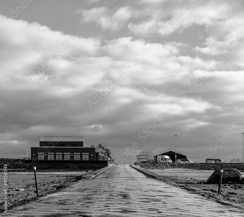 Vendée, France; January 15, 2021: black and white photo of the passage du Gois on the land side.