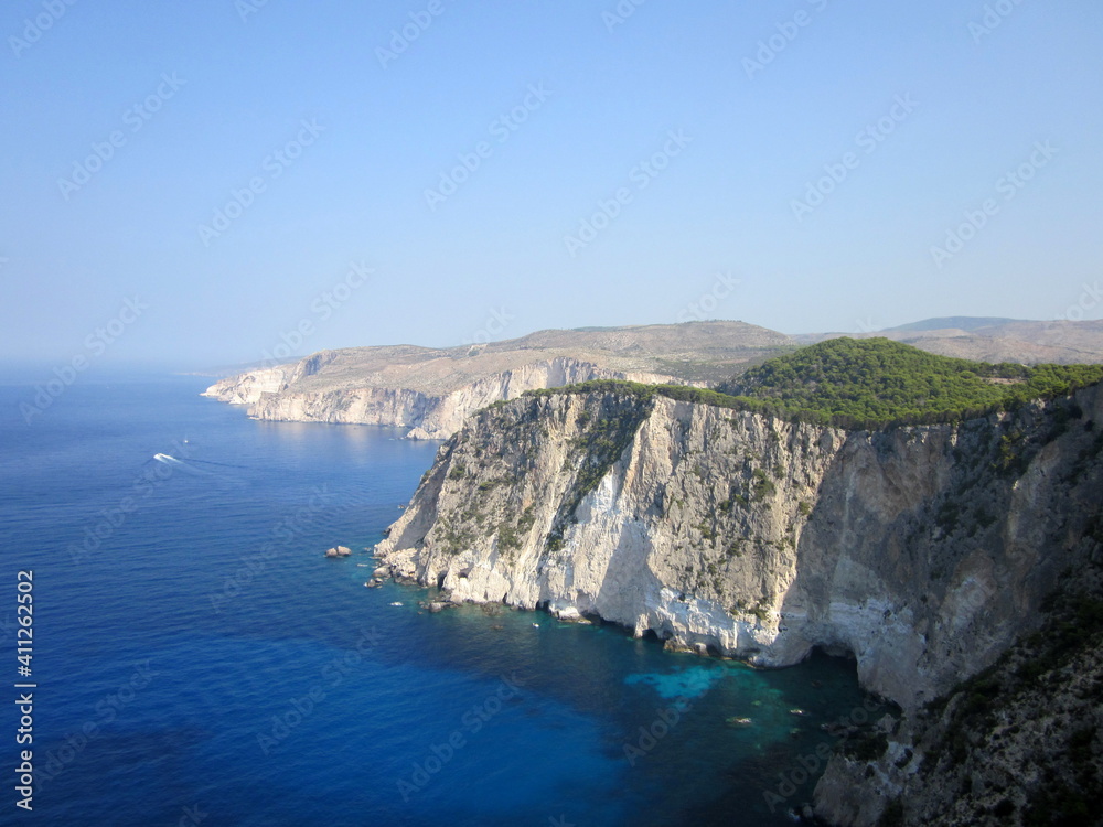 Beautiful west cliff coast at Zakynthos (Zante) island. Rocky steep cliffs on the wild western Zakynthos. Kambi Schiza bay, Ionian Island, Greece, Europe