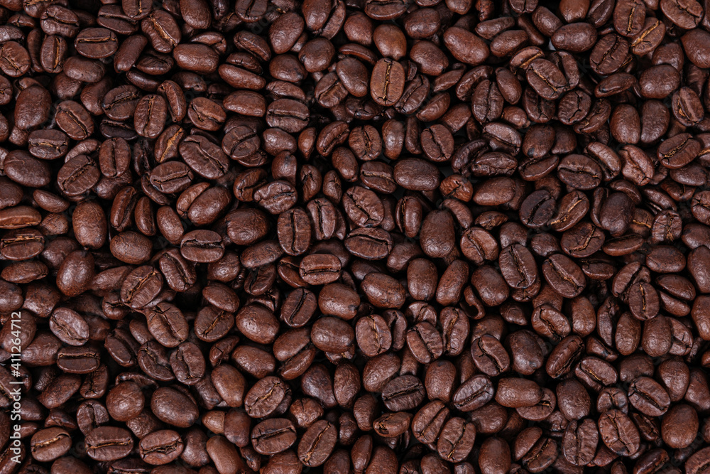 Fototapeta premium Medium roasted coffee beans, blonde or light roasted coffee beans background