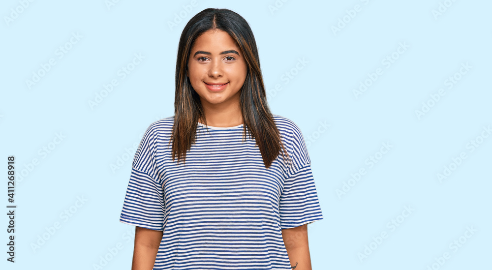 Young latin girl wearing casual clothes with a happy and cool smile on face. lucky person. Young latin girl wearing casual clothes with a happy and cool smile on face. lucky person.