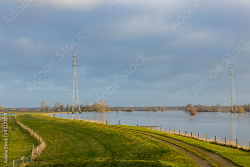Landscape with the river IJssel overflowing its boundaries into floodplains making its way trough the high water levels