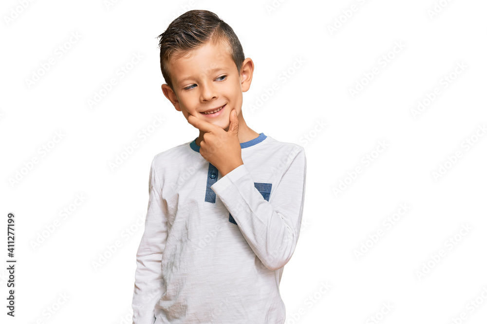 Adorable caucasian kid wearing casual clothes with hand on chin thinking about question, pensive expression. smiling with thoughtful face. doubt concept. Adorable caucasian kid wearing casual clothes with hand on chin thinking about question, pensive expression. smiling with thoughtful face. doubt concept.