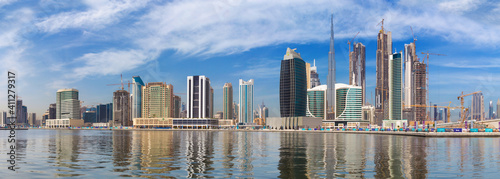 DUBAI, UAE - MARCH 29, 2017: The skyline with the bridge over the new Canal and Downtown and Burj Khalifa tower. © Renáta Sedmáková