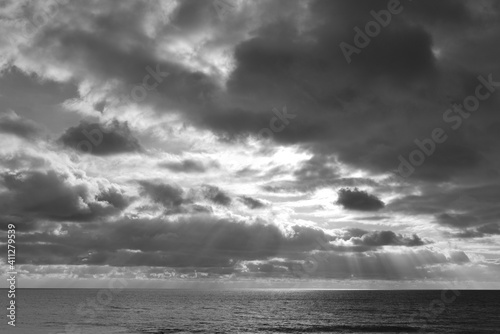 Rays of sunlight storm over the sea Cornwall 