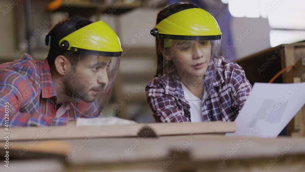 Carpenter and design team are Check quality the wood specification in furniture design in the factory. Wearing safety Mechanic Mask while working. Product quality inspection service. Concept Teamwork Carpenter and design team are Check quality the wood specification in furniture design in the factory. Wearing safety Mechanic Mask while working. Product quality inspection service. Concept Teamwork