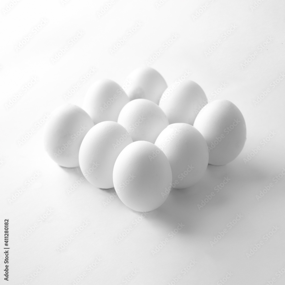 Eggs on a white background. Minimal easter concept. High-key minimalistic photography Eggs on a white background. Minimal easter concept. High-key minimalistic photography