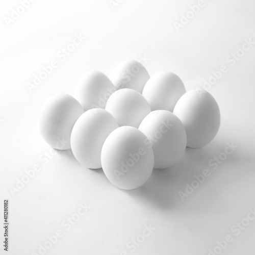 Eggs on a white background. Minimal easter concept. High-key minimalistic photography