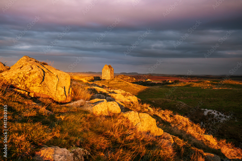 Smailholm tower landscape with the Eildons at sunset