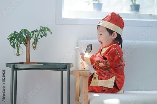 Portrait cute boy in Chinese New Year shirt,Asian cute boy in Chinese New Year concept