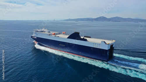 Aerial drone photo of Roll on Roll off vehicle carrier vessel (RO RO) cruising open ocean Mediterranean deep blue sea