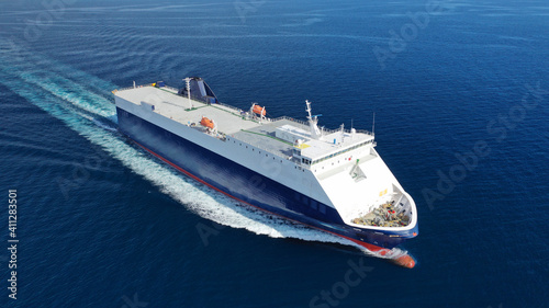 Aerial drone photo of Roll on Roll off vehicle carrier vessel (RO RO) cruising open ocean Mediterranean deep blue sea
