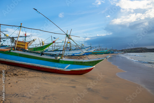 Fishing boats on the beach in Galle of Sri Lanka.