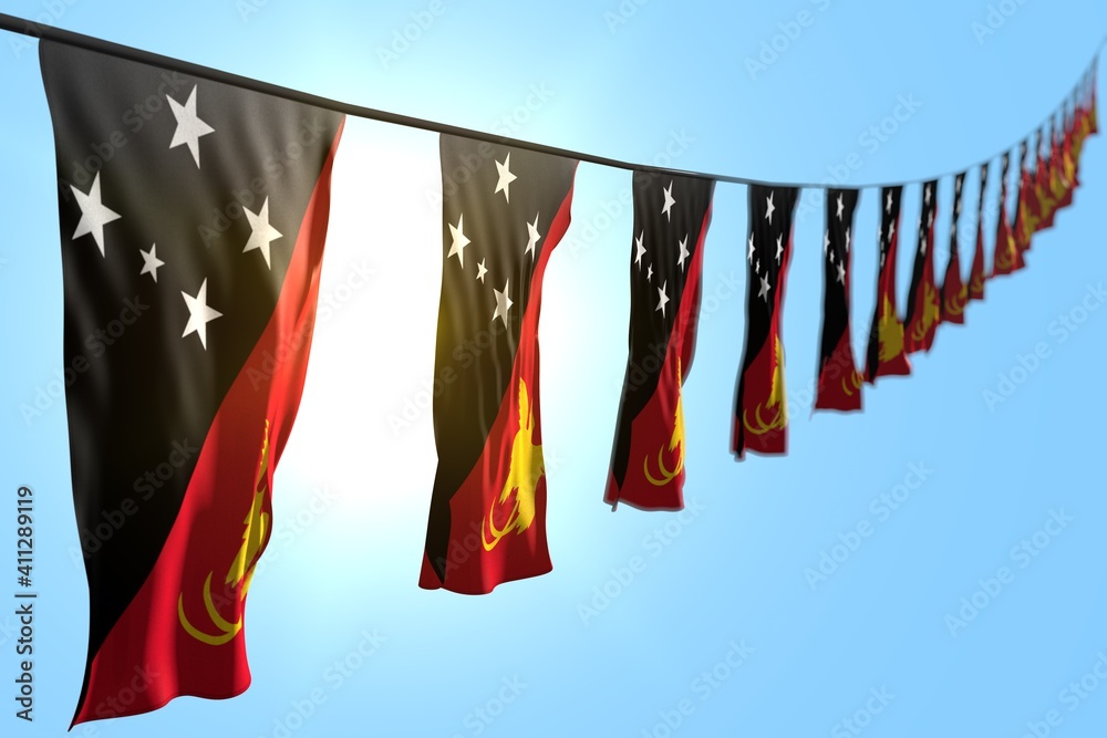 pretty many Papua New Guinea flags or banners hangs diagonal on string on blue sky background with bokeh - any occasion flag 3d illustration..