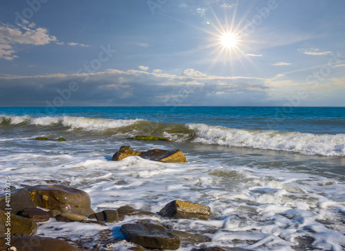 Fototapeta Naklejka Na Ścianę i Meble -  emerald sea coast with stones at the hot summer sunny day
