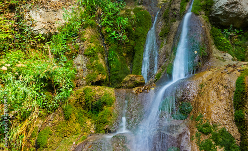 small waterfall on the mountain river