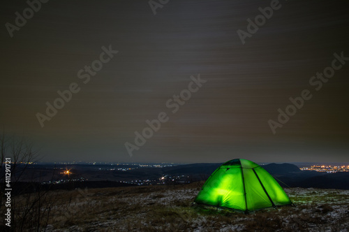 Long exposure tent against the background of the starry sky © onyx124