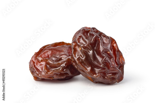 Close-up two Raisins isolated on white background. Clipping path.