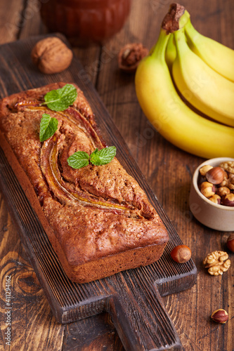 Banana bread with walnuts, hazelnuts and cinnamon. Sweet homemade dessert. 