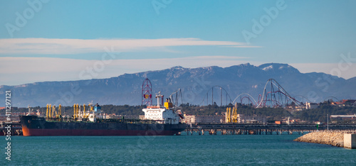 Фотография Spain; Jan 2021: Port Aventura World, theme park pictured from the harbor, mount