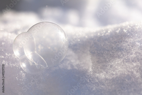 soap bubbles frozen lie in the snow