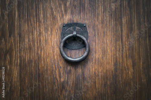 ancient door handle on old wood door