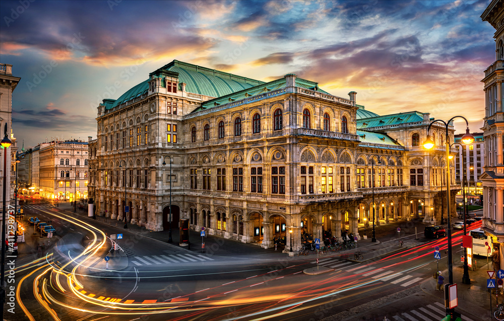 Obraz na płótnie Vienna State Opera. Veinna, Austria. Evening view. The historic opera house is a symbol and landmark of the city of Vienna.  Panoramic view, long exposure. w salonie