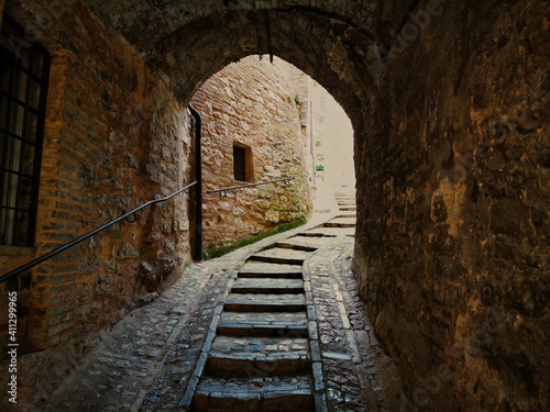 glimpse of an alley in the town of Spello in Italy